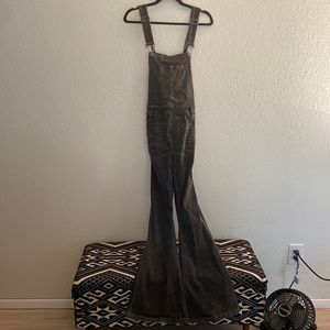 Free People distressed black flare overalls